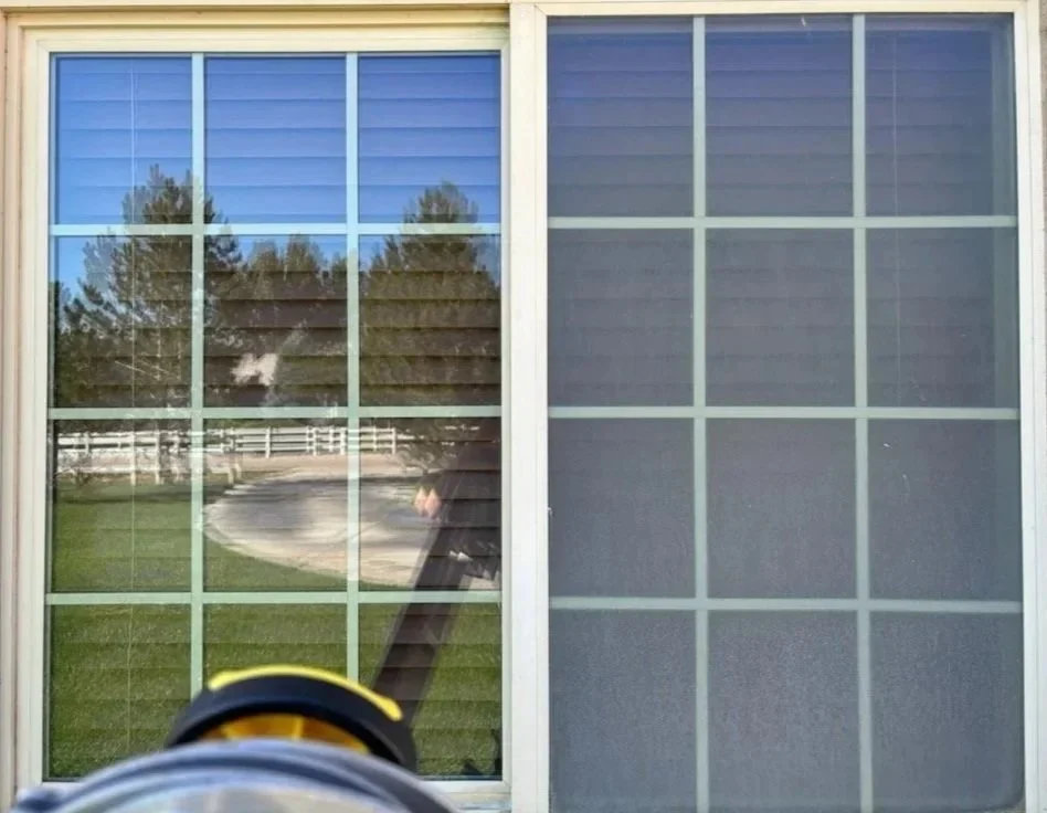 Two windows side by side, the left one cleaned and clear, the right one still dirty